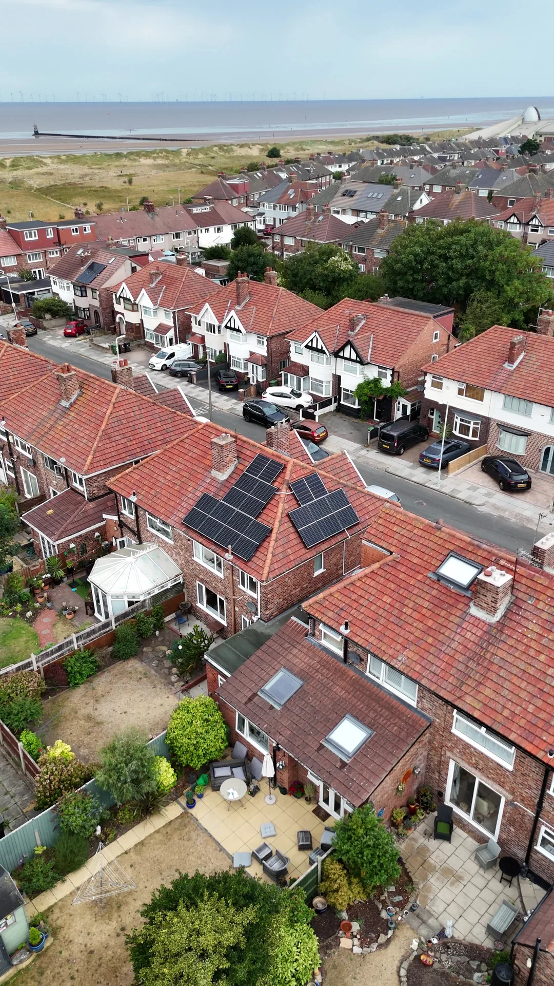 Drone view: solar panels on a coastal semi-detached house