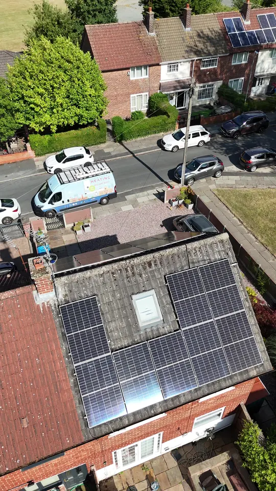 Drone view looking down on the Liverpool Heating van parked below the same house's rear solar array