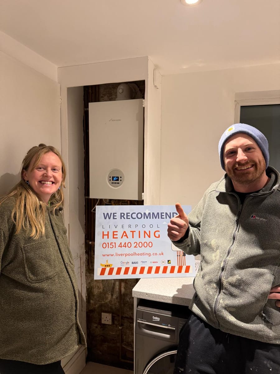 A customer giving a thumbs up beside their new Worcester boiler